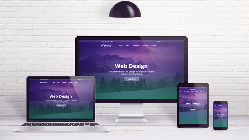 Desktop screen, laptop, tablet and smartphone displaying responsive website design