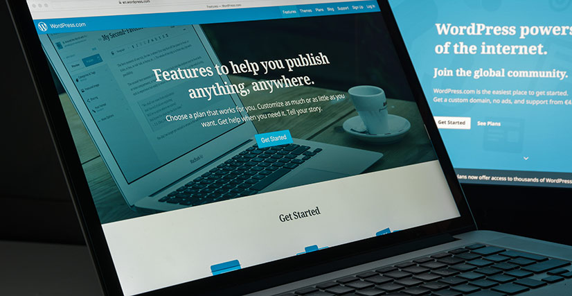 Laptop with WordPress website on the screen